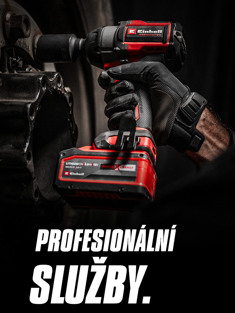Detailní záběr červeného aku rázového utahováku používaného na kole s nápisem „Professional Services“.