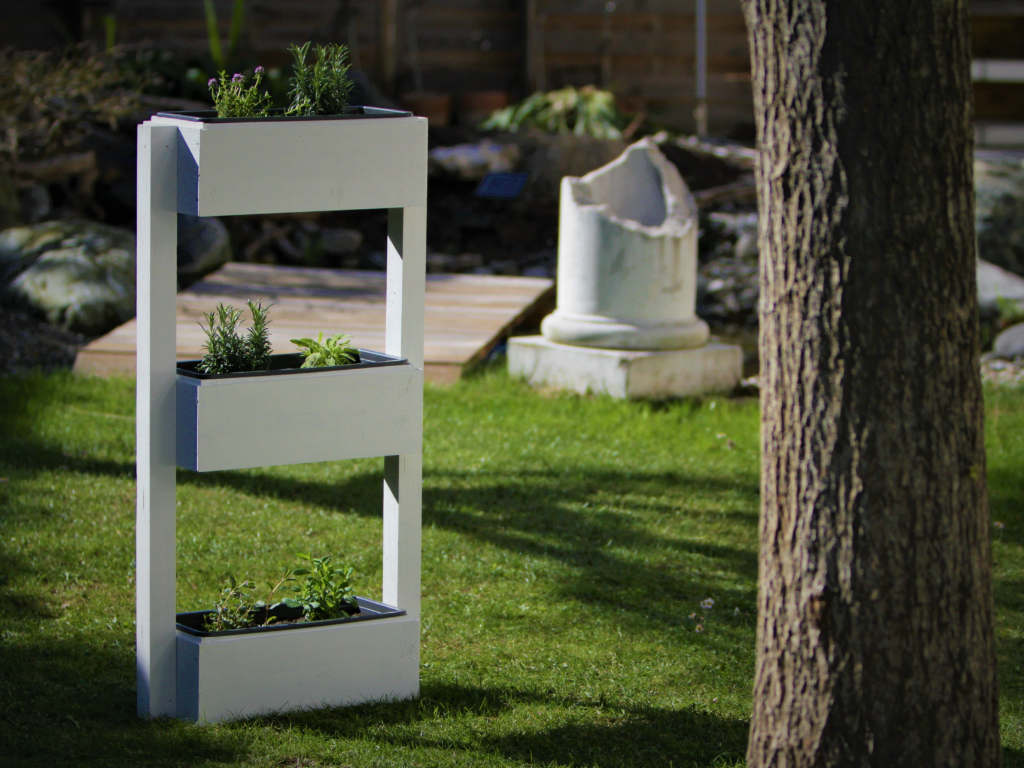 Wooden flower decorations are in the garden