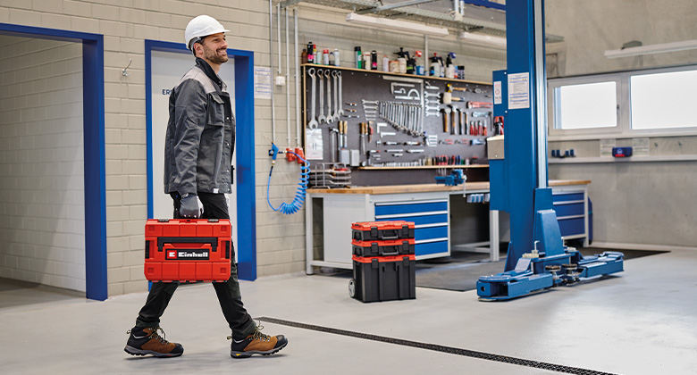A man walking into the workshop with the Einhell E-Case