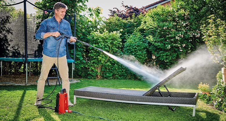 man working with a hgih pressure cleaner